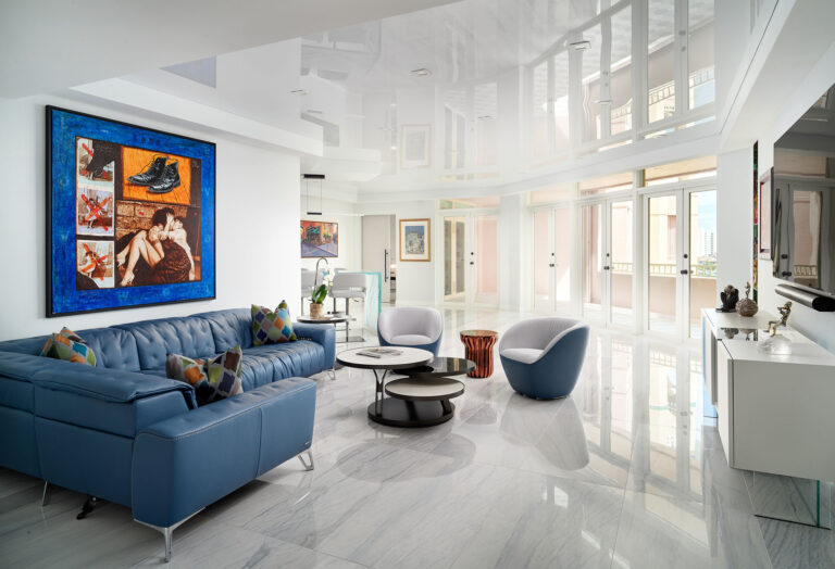 Living Room long view with sofa wall art dining chairs
