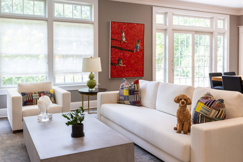 Living Room with cute dog on sofa wall art center table